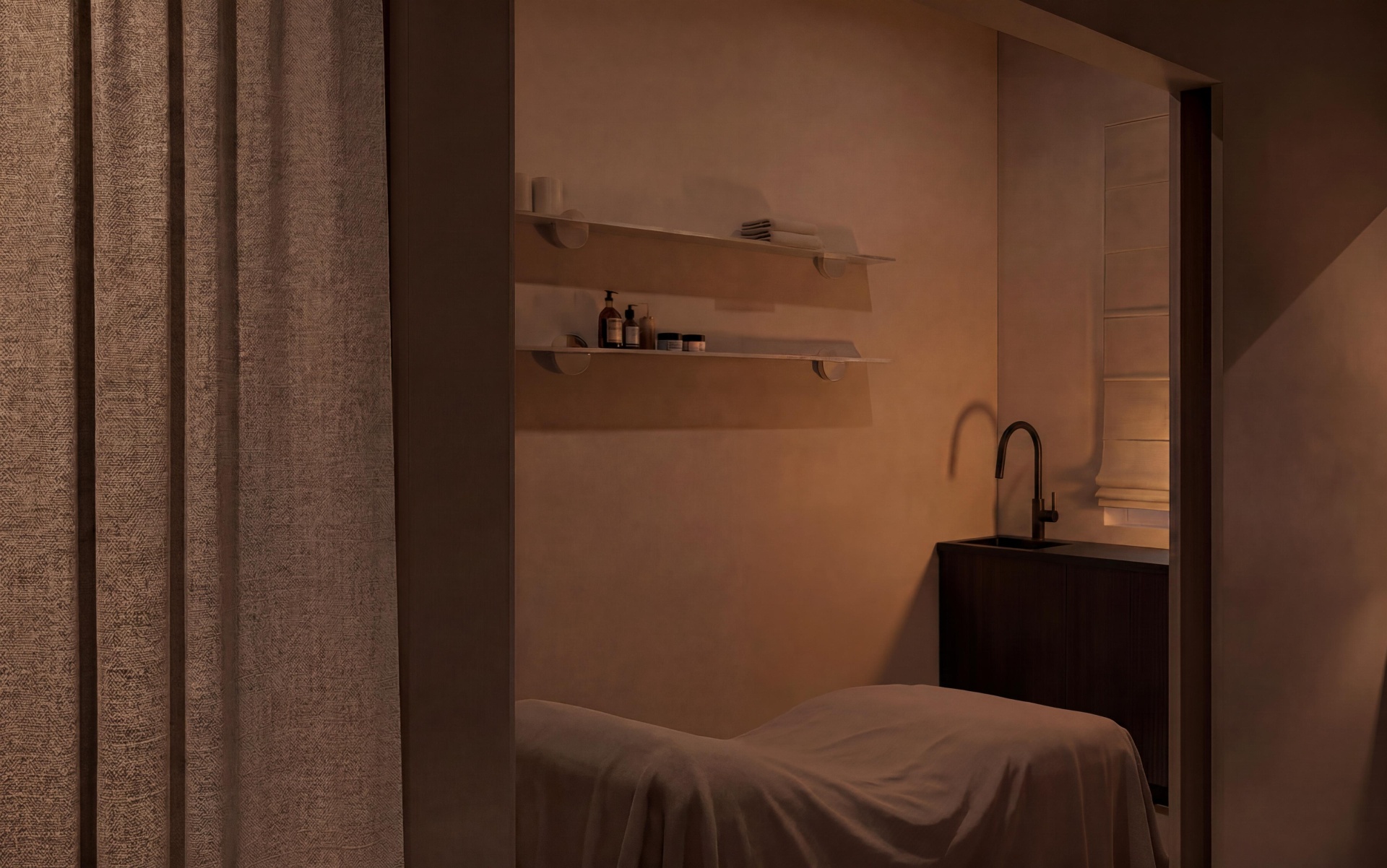 A warm treatment room with shelves and a massage table